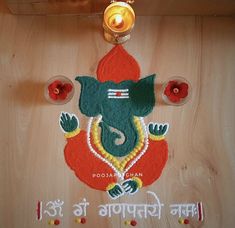 an image of a ganeshi decoration with candles