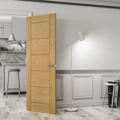 an open door in the middle of a white room with stools and tables around it