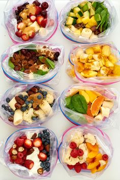 six plastic containers filled with different types of fruit