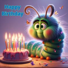 a very cute looking caterpillar next to a birthday cake with candles on it