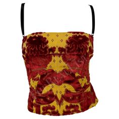 Presenting a gorgeous red and yellow Dolce and Gabbana boned tank top. From the Spring/Summer 2000 collection, a version of this top debuted on the season's runway and was also highlighted in the season's ad campaign, modeled by Gisele Bundchen. This fabulous tapestry corset top features internal boning, a built-in bra, and a square neckline. Approximate measurements: Size - 42 IT Shoulder to hem: 12" Bust: 30" Waist: 26" Unique Vintage Clothing, Dolce And Gabbana 2001, Vintage Designer Aesthetic, Red And Brown Outfit, Red And Yellow Outfit, Corseted Top, Tapestry Corset, Clothing Png, Dolce And Gabbana Runway