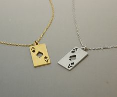 "This necklace features a delicate Ace of Spade charm plated in either gold or silver. The necklace is perfect for those who want to add a touch of uniqueness to their everyday wear. The material used in this necklace is non-tarnish, so you don't have to worry about the metal losing its shine over time. The necklace would make a great gift for anyone who loves playing cards, or unique jewelry. The combination of the unique design of the Ace of Spade and the shiny gold or silver plating creates a Ace Necklace, Spade Necklace, Womens Silver Jewelry, Card Necklace, Ace Of Spades, Personalized Notes, Playing Card, Metal Necklaces, Gold Jewelry Fashion