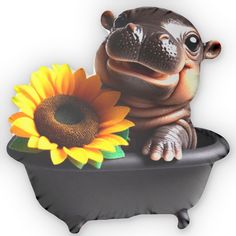 an inflatable hippo sitting on top of a bathtub with a sunflower