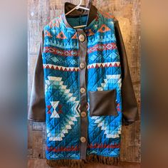 New From My Craft Boutique Original By Donna Turquoise Aztec Coat With Faux Suede Sleeves & Collar Front Pocket Button Closure Fringe At Bottom Measures 20" P To P 38" Long Bohemian Winter Outerwear With Button Closure, Blue Bohemian Outerwear With Pockets, Blue Fall Outerwear With Snap Buttons, Blue Outerwear With Snap Buttons For Fall, Denim Recycle, Craft Boutique, Textured Coat, Painted Jacket, Blanket Coat