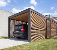 a car is parked in the garage with it's door open to allow shade