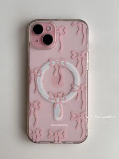 an iphone case with pink and white designs on it