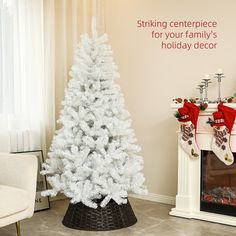 a white christmas tree in a living room next to a fireplace with stockings on it