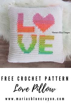 a crocheted pillow with the words love written on it