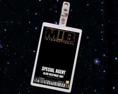 an id badge is attached to a lanyard with space in the background and stars