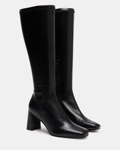 A half-zipper closure gives the HOLLY knee boot a calf-defining fit while an angled block heel and a square toe giving this style a sharp finish. Square toe block heel knee boot Side half zipper closure Angled block heel 2.75 inch heel height Size 6 measurements: 12 inch shaft circumference, 14.25 inch shaft height Size 8 measurements: 14.5 inch shaft circumference, 15.5 inch shaft circumference Size 10 measurements: 15 inch shaft circumference, 16 inch shaft height Vegan leather upper material Kitten Heel Slingbacks, Steve Madden Store, Wedge Loafers, Steve Madden Boots, Boots Square Toe, Black Knee High Boots, Holly Black, Exclusive Shoes, Leather Socks