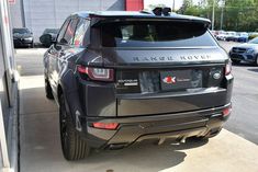 the rear end of a range rover parked in a parking lot