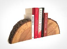 three books are stacked on top of each other in the shape of a tree trunk