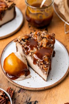 there is a piece of cake on the plate with caramel and walnut toppings