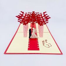 a red and white wedding card with a bride and groom