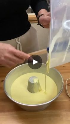 a person is mixing something in a bowl