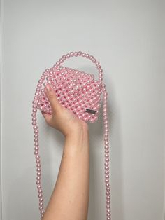 Elevate your outfit with Handmade Candy Pink Pearl beaded bag. Perfect for casual day and add to your pink collection. Bags are 100% handmade. Bags are made to order. We give effort and love of making our bags. Bags are on limited stocks. DM us to order more pieces.  This model can fits 👛: Mini perfume Compact mirror Airpods And other miniature products. Materials: Acrylic pearl beads 10mm Measurements: Height 10cm Length 13 cm  Depth 4cm Pearl strap (113mm) Trendy Pink Bag With Pearl Handle, Trendy Pink Shoulder Bag With Pearl Handle, Mini Pearl Bag, Small Pink Shoulder Bag, Pink Bags With Pearl Handle For Daily Use, Pink Bag With Pearl Handle For Daily Use, Pink Beaded Bags For Daily Use, Pink Beaded Bag For Everyday Use, Pink Party Shoulder Bag Suitable As Gift