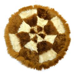 a brown and white animal print rug on a white background