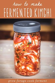 a jar filled with food sitting on top of a wooden table