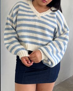 The On the Go Striped Cropped Knit Sweater is the perfect chunky cropped knit to add to your closet. Style with your favorite denim jeans and sneakers for an everyday look. For a little bit of a more dressed up look, Color: White & Blue 100% Polyester Striped Long-sleeve v-neck sweater Cropped length Fits true to size Jocelyn is wearing size Small Trendy Chunky Knit Cropped Sweater, Trendy Chunky Cropped Sweater, Trendy Knitted Cropped Sweater, Casual Blue Cropped Sweater In Soft Knit, Casual Blue Cropped Soft Knit Sweater, Trendy Cropped Chunky Knit Sweater, Casual Blue Soft Knit Cropped Sweater, Casual Cropped Knitted Sweater, Trendy Cropped Knitted Sweater