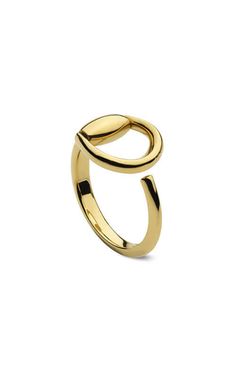 a gold ring with two intertwined rings on the top and bottom, set against a white background