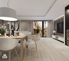 a modern living room and dining area with wood flooring, white furniture and large windows