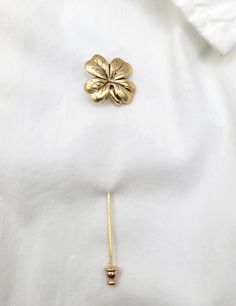 Show your Irish heritage or let that special someone know how lucky you feel to have them in your life.   Beautiful 24k gold plated four leaf clover stick pin is perfect for your wedding party.     This four leaf clover has been antiqued to bring out the beautiful detail. Wonderful accessory from days gone by. Stick pin measures 3 1/4 inches long.  Clover is 3/4 inch in diameter.    This piece can be used as a lapel pin for men or a stick pin for women.  Choose from the drop-down how you would like yours packaged.   Your order will be shipped in 2-3 business days.  Every piece is handcrafted in my home jewelry studio and is one of a kind.   All of my pieces are sent in a gift box ready for gift giving.  (See the last pictures in this listing.) More of my jewelry can be found at:  myvintage Gold Four Leaf Clover, Irish Clover, Irish Heritage, Woodland Garden, Wedding Hair Pins, Four Leaves, Jewelry Studio, Stick Pins, Four Leaf