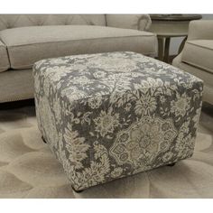 a large ottoman sitting on top of a rug