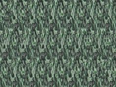 an abstract green and black pattern on fabric