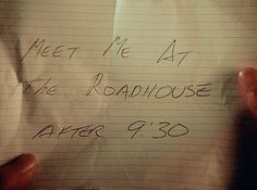 someone holding up a note with the words meet me at the roadhouse after 9 30