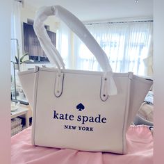 Gorgeous Nwt Kate Spade Leather Tote In An Off White Color With Black Lettering. Super Spacious And Convenient With A Zipper To Protect Your Possessions. New And I Love But Did Not Get To Use And Trying To Declutter. There Is A Small Area Of Glue Residue Close To Zipper, Though That Can Be Stored Inside The Bag, It Was Always There. Will Include The Dust Bag. From A Smoke Free And Pet Free Home. Off White Color, Suitcases, Kate Spade Bag, Womens Tote Bags, Random Things, Declutter, Leather Tote, White Color, Wallets