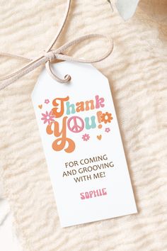 thank you for coming and growing with me gift tag hanging on a towel next to flowers