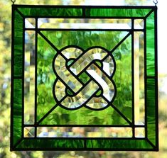 a stained glass window with a knot on it