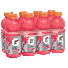 six gatorade drink bottles with orange caps