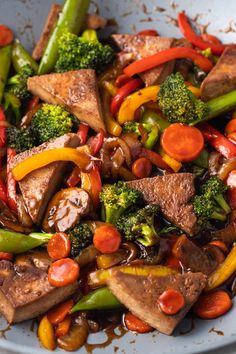 stir fry with broccoli, carrots and other vegetables