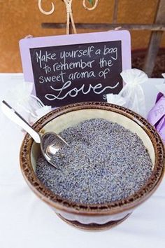 a bowl filled with some sort of food next to a sign that says make yourself a bag to remember the sweet aroma of love