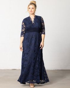 Effortless beauty meets classic style with our Screen Siren Lace Gown. Designed with all-over stretch, this elegant fit and flare evening dress will flatter and accentuate your beautiful curves. A ruched waistband in a contrasting fabric pulls the eye inward to the smallest part of your body and a scalloped neckline and sleeves add that special detailing. This plus size special occasion dress is the ideal formal pick for any black-tie affair. Kiyonna's plus size formal gowns and special occasion