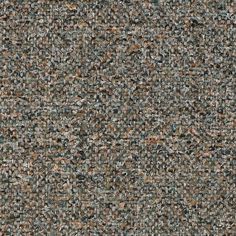 an up close shot of the texture of a carpet with many different colors and sizes