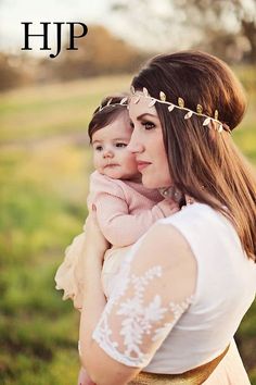 a woman holding a baby in her arms with the words hip written on top of it