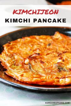 a close up of a pancake on a plate with the words kimchitoon