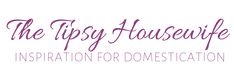 the tipsy housewife's logo is shown in purple and black lettering on a white background