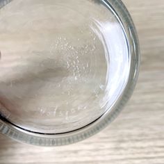 a person holding a glass with water in it