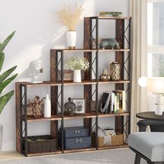 a living room filled with lots of furniture and bookshelves next to a window