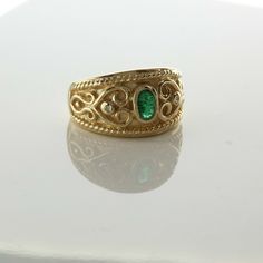 14K Yellow Gold Emerald and Diamond Ring, dark oval emerald center with round diamond accents wirework scrolls, Ring size 6.25, Circa 1980, 6.8 grams SKU# BB263R10 This listing contains photographs of the actual item you will receive. Our items are in excellent condition with little or no signs of wear and many are one of a kind pre-owned estate finds. Please look closely at the pictures in this listing as they are part of the product description. Please read the description, as any imperfection Victorian Oval Yellow Gold Emerald Ring, Victorian Oval Emerald Ring In Yellow Gold, Antique Gold Emerald Ring With Oval Cabochon, Antique Emerald Ring In Gold With Oval Cabochon, Oval Emerald Ring Fine Jewelry Collectible, Heirloom Gold Emerald Ring With Oval Cabochon, Antique Engraved Oval Emerald Ring, Antique Oval Engraved Emerald Ring, Oval Gold Emerald Ring With Intricate Design