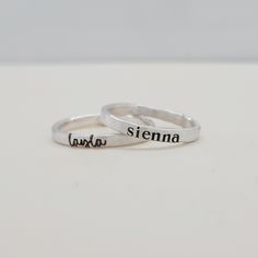 Mother's Day Gift | This personalized stacking ring features a unique and stylish handwriting font or serif font, adding a personal touch to your jewelry collection. Handmade with care, each ring is crafted with fine silver materials for a luxurious look and feel. Make a statement with this modern and customizable piece. Includes one name ring in your choice of font. Everyday Meaningful Hand Stamped Stackable Rings, Personalized Adjustable Rings For Everyday, Mother's Day Adjustable Stackable Rings With Custom Name, Everyday Stackable Rings With Custom Name, Adjustable Stackable Rings With Custom Name For Mother's Day, Adjustable Engraved Stackable Ring For Everyday, Everyday Adjustable Stackable Engraved Ring, Personalized Name Sterling Silver Stackable Rings, Personalized Silver Engraved Ring