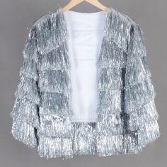 Welcome to my shop, I am in China. It will need around 20 days for international orders. Please consider the time when placing order. Quicker express DHL,Fedex,UPS available(NEED ADD SHIPPING COST). Please send us a message with any questions or deadlines before placing order! Magical tinsel fringe jacket!  Fun to wear and looks epic in the sun! Perfect for concert,wedding,birthday,party,costume event,rave and so on. This is made of double layers tinsel tassels,so it may quite heavy and not suitable for hot days. This item is made to order - and can be custom made. Not accept returns or replacement. Body Length is measure from neck point to bottom. Please carefully check each sizes: S US women's 0-4 Shoulder width: 16.5 inches(42cm) Bust width:20.5 inches(52cm) Sleeve length:20 inches(50cm Winter Party Outerwear With Tassels, Silver Fringe Jacket Outfit, Party Outerwear With Tassels, Chic Silver Party Outerwear, Sparkly Fringe Jacket, Silver Fringe Jacket, Metallic Fringe Jacket, Rainbow Tinsel Jacket, Glitter Jacket