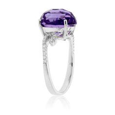 14K White Gold .13ctw Diamond and 5.36ctw Amethyst Ring Slip into the depths of calming purple when you wear this amethyst and diamond ring. A 5.36ctw fancy-cut amethyst is like a soothing well of wisdom and peace. Brilliant diamonds stand out against a 14K white gold band and curve around the amethyst, accenting its tranquil energy. Click here to read more about the characteristics of this February birthstone. Product Details Ring Information Center Gemstone Accent Stones Style #: YCH Y370596RW Amethyst And Diamond Ring, 1 Number, Information Center, Detailed Ring, White Gold Band, February Birth Stone, Brilliant Diamond, Amethyst Ring, Number 1