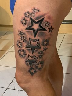 a woman's thigh with stars on it