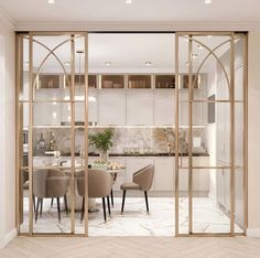 an open glass door leading to a dining room and kitchen area with marble flooring