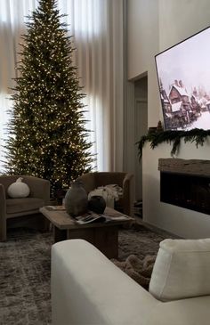 a living room filled with furniture and a christmas tree in front of a flat screen tv