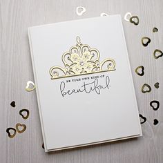 a white card with gold foil on it that says be your own kind of beautiful